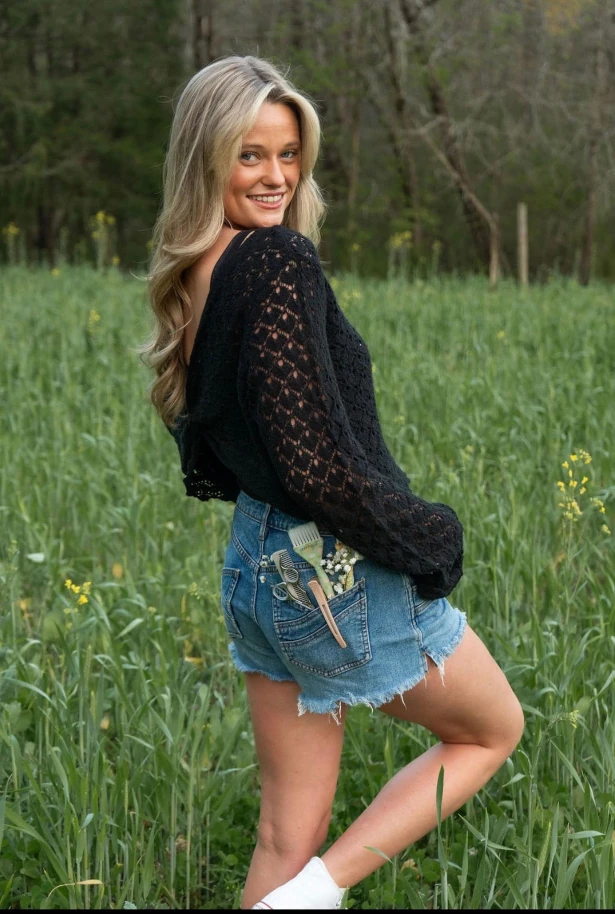 Meet Dae Troutman posing in nature. she is a creative up and coming a hairstylist that creates her magic at Luxe 405 Hair Studio in Asheboro, NC,
